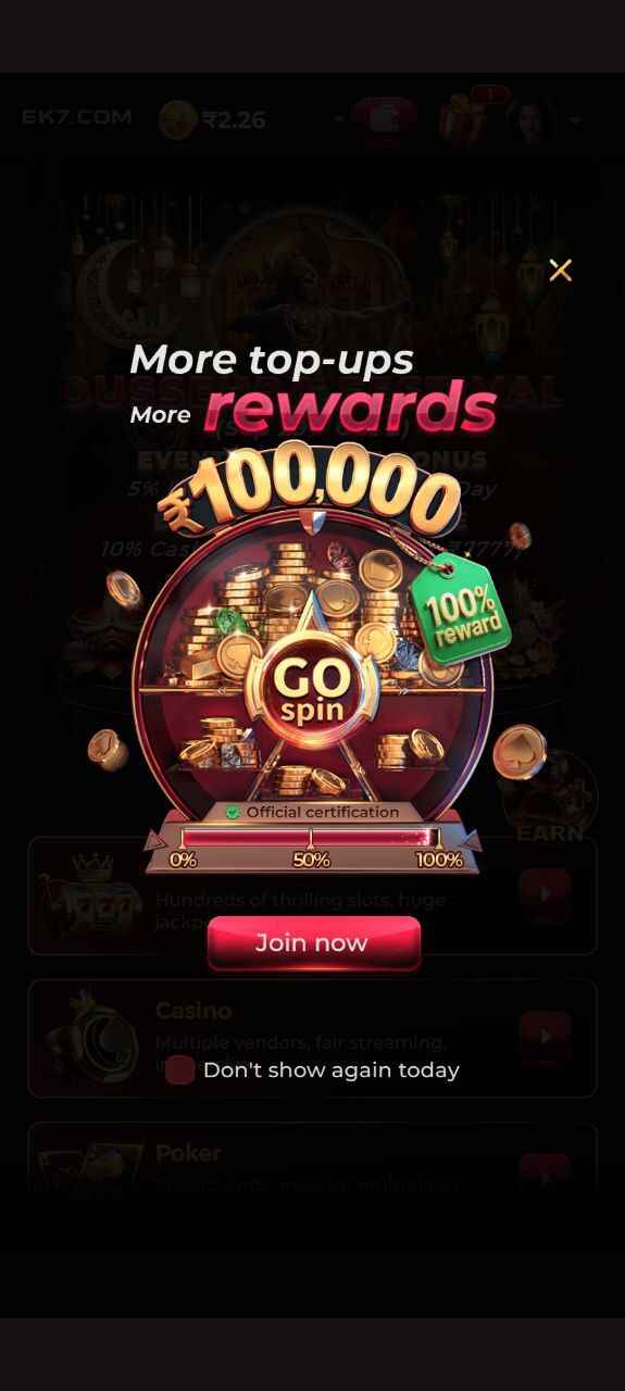 “EK7 game bonus screen with spin wheel rewards and top-up offers”